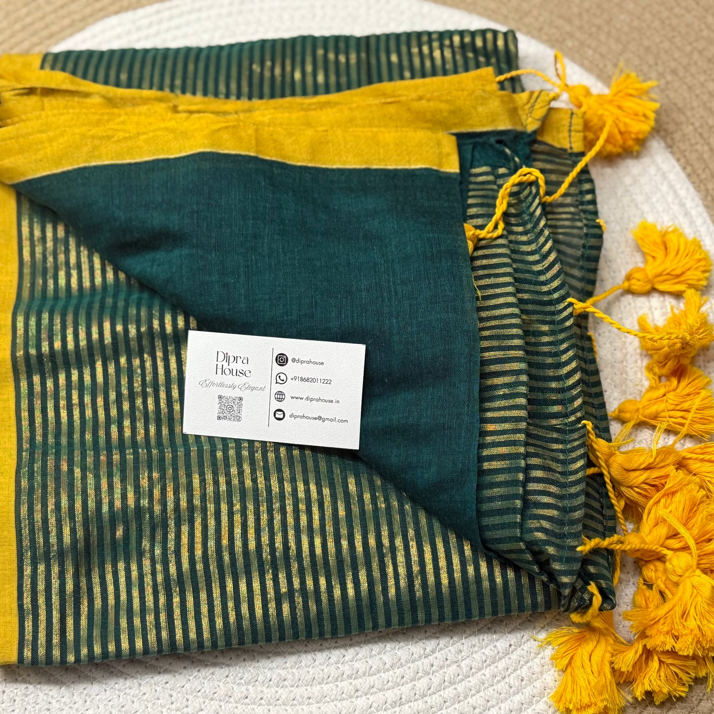 Green colour mulmul saree with golden stripes