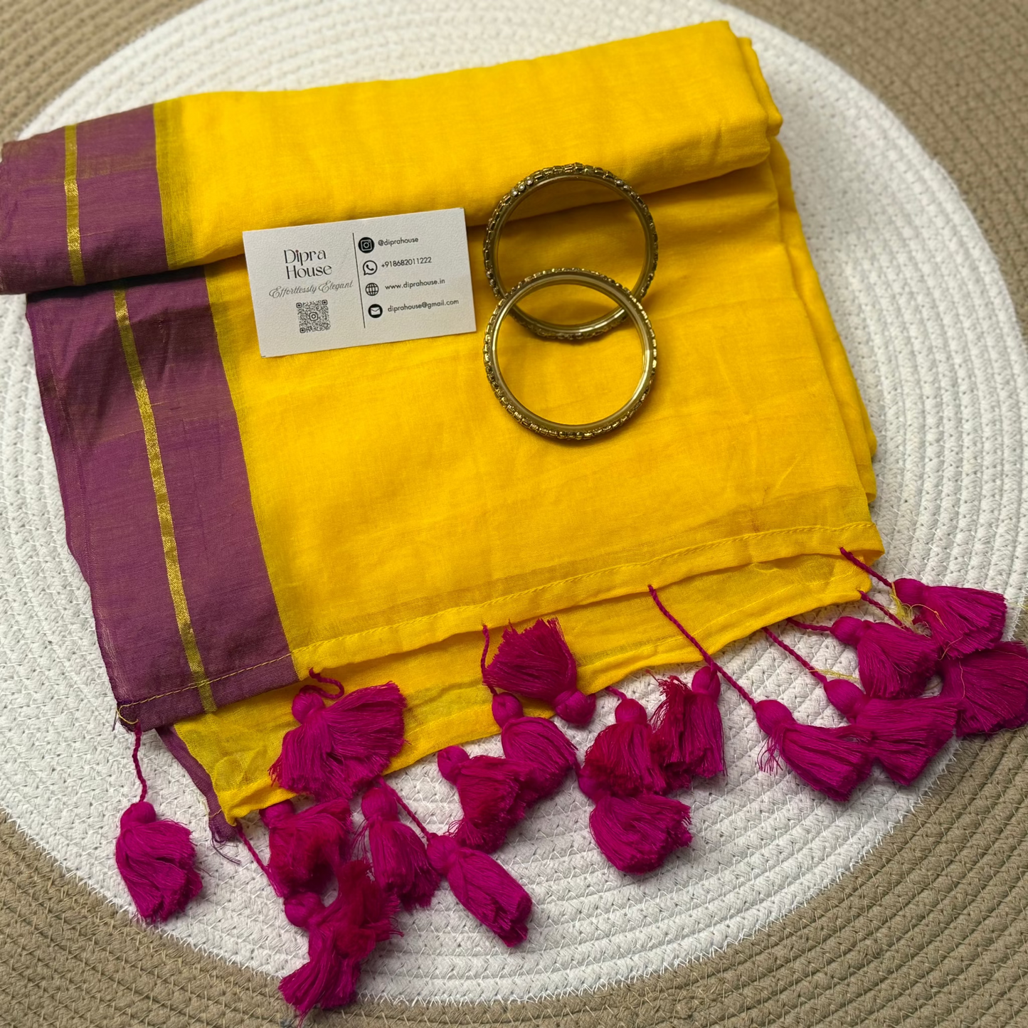 Golden Line Zari Yellow colour Mul Cotton Saree with contrast pink border and tassels